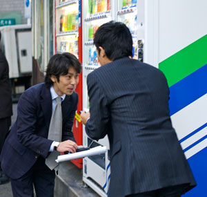 Photo of Two businessmen exchanging Japanese business cards